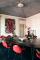 Inside Yashar's Milan apartment: Table by Bruno Mathsson and vintage red leather chairs by Carlo Mollino
