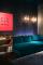 Easy Corner Sofa by Jean Royère, France, 1957; Appliques by Venini, Italy, 1932-35; and artwork by Paolo Scheggi