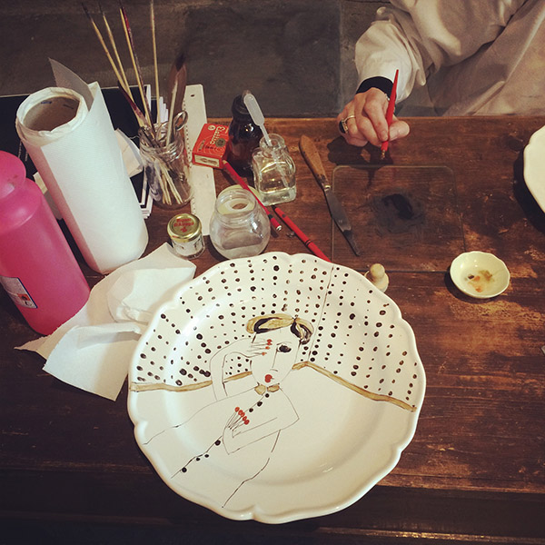 handpainted Segno Italiano plates, each featuring a Marras drawing