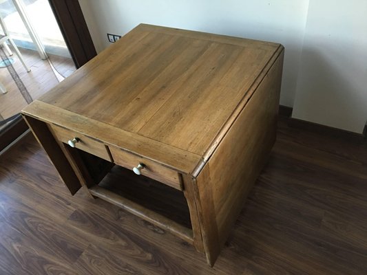 Gate leg deals table with storage