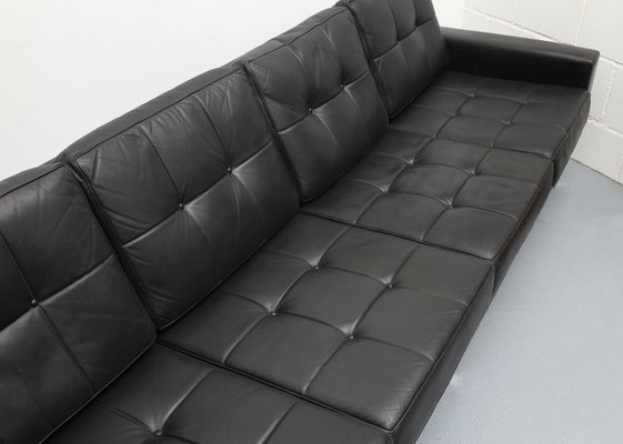 4 seater black leather sofa