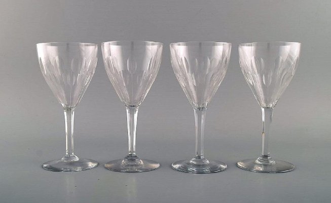 https://cdn20.pamono.com/p/g/1/0/1098819_ze30bi2ndi/baccarat-red-wine-glasses-in-clear-mouth-blown-crystal-glass-france-set-of-9-2.jpg
