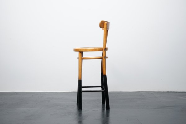 Wooden stool with outlet backrest