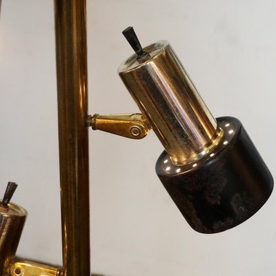 Spring loaded store pole lamp