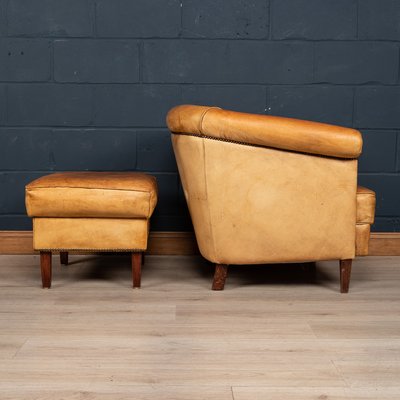 Tan leather chair and footstool sale
