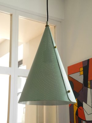 Perforated metal lamp outlet shade
