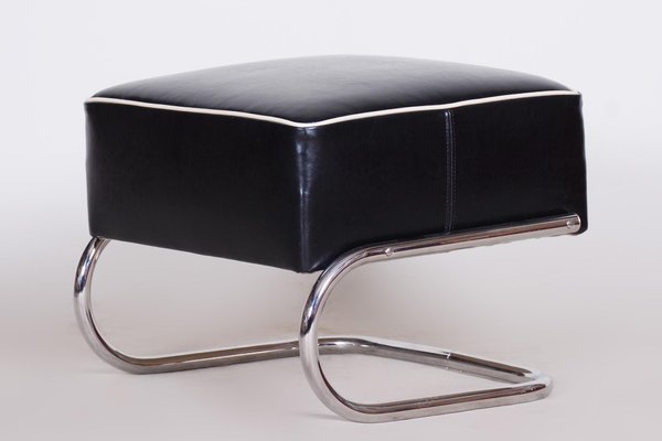 Black leather footstool with chrome legs top