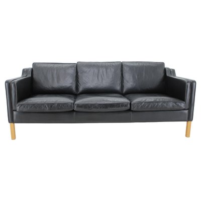 Black leather three sales seater sofa