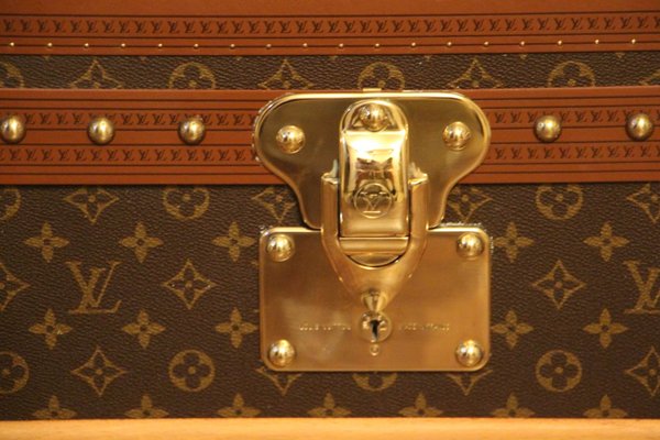Lot - An early 20th Century steamer trunk by Louis Vuitton LV monogrammed  canvas case, Louis Vuitton marked brass rivets, reinforced corners