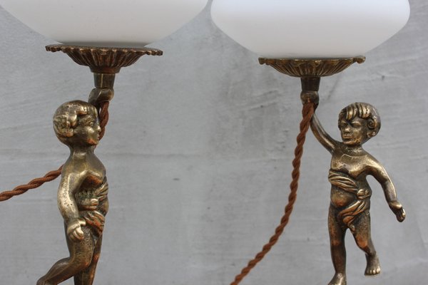 Vintage brass store cherub lamps