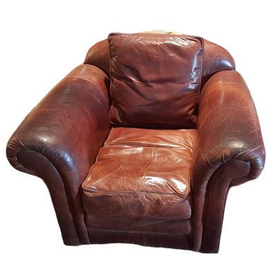 Brown leather store club chair recliner