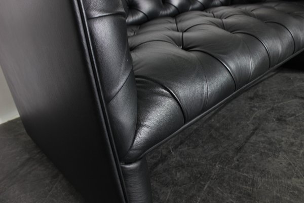 Tufted black leather couch top