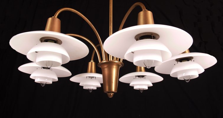 https://cdn20.pamono.com/p/g/1/2/120464_mk1kwhdcia/bombardment-chandelier-by-poul-henningsen-for-louis-poulsen-1930s-2.jpg