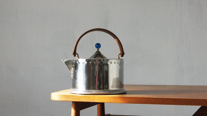 https://cdn20.pamono.com/p/g/1/2/1215481_6ucgq43ea0/vintage-stainless-steel-teapot-by-c-joergensen-for-bodum-1980s-1.jpg