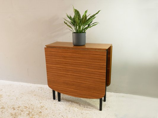 mid-century-extending-drop-leaf-dining-table-with-black-frame-1960s-2.jpg