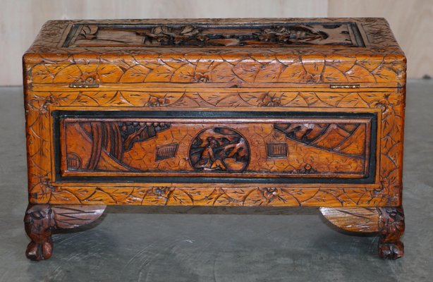 Hand carved on sale wooden chest