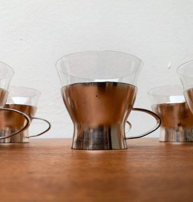 https://cdn20.pamono.com/p/g/1/2/1289266_ihexgyeu9q/mid-century-german-tea-glasses-from-wmf-1960s-set-of-4-25.jpg