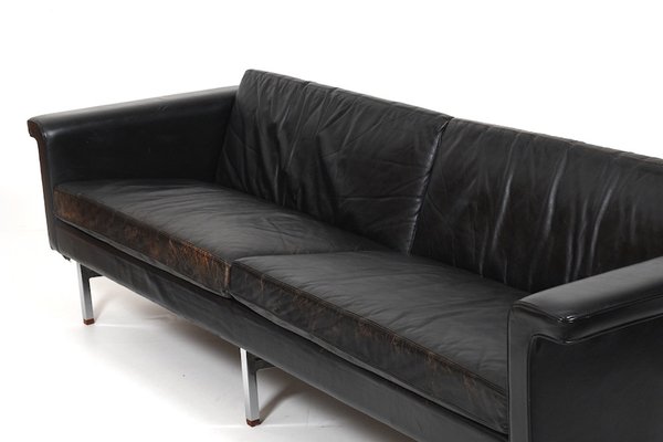 Modern black leather sofa 2024 with chrome legs