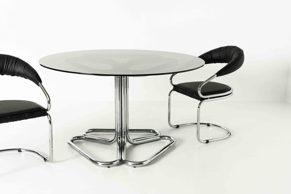 Smoked glass 2024 dining room table