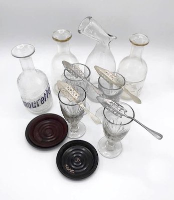 https://cdn20.pamono.com/p/g/1/3/1347278_ntni3kw012/absinthe-drinking-glasses-set-set-of-16-1.jpg