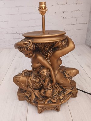 Bronze cherub 2024 table lamp