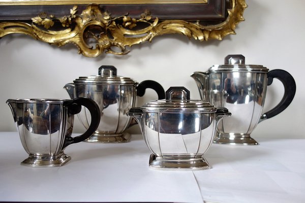 https://cdn20.pamono.com/p/g/1/3/1373587_fpecrv0ogy/parisian-silver-edition-coffee-and-tea-service-by-ravinet-denfert-1920s-set-of-4-1.jpg