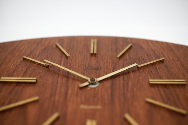 Mid-Century Modern Teak and Brass Wall Clock by Elexacta Schatz