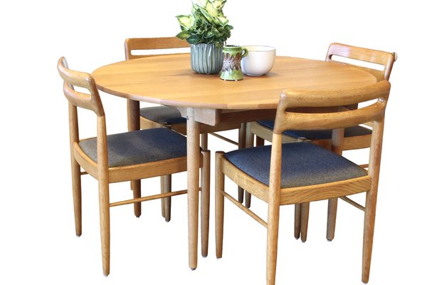Round dining table with outlet tuck in chairs