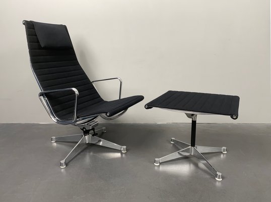 Aluminum EA 124 Rotating Armchair with Ea 125 Footstool by Charles