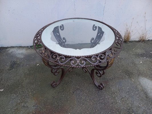 Cast iron coffee table with glass top outlet