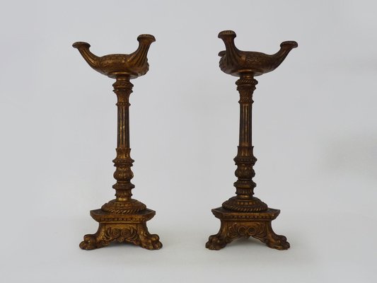 https://cdn20.pamono.com/p/g/1/5/1501368_kbusqg0m5c/church-candleholders-with-lions-paw-in-carved-gilt-wood-1890s-set-of-2-1.jpg