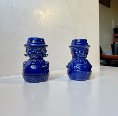 https://cdn20.pamono.com/p/g/1/5/1502805_k602x8amt4/vintage-blue-glaze-figural-man-wife-ceramic-candlesticks-1970s-set-of-2-1.jpg
