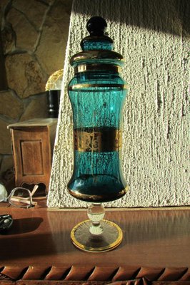https://cdn20.pamono.com/p/g/1/5/1503089_rotfiaoxwo/covered-pot-or-bottle-in-tinted-glass-1960s-1.jpg