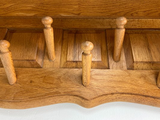 https://cdn20.pamono.com/p/g/1/5/1523165_wtrql1uq85/mid-century-scandinavian-oak-wall-mounted-coat-rack-with-turned-wood-hooks-1960s-10.jpg