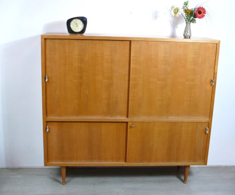 Mid century sideboard with sliding doors outlet