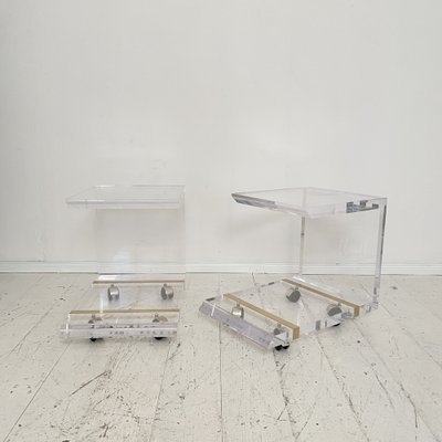 https://cdn20.pamono.com/p/g/1/5/1539200_oh1i2nehwv/mid-century-acrylic-glass-and-brass-side-tables-on-wheels-by-charles-hollis-jones-1971-set-of-2-13.jpg