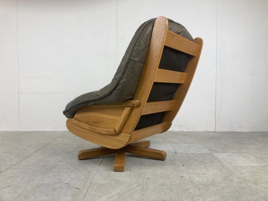 Brutalist Oak and Leather Swivel Chair, 1970s for sale at Pamono Brutalist Oak and Leather Swivel Chair, 1970s for sale at Pamono