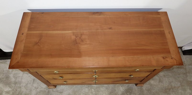 Commode directoire en merisier formant secrétaire. XIX siècle