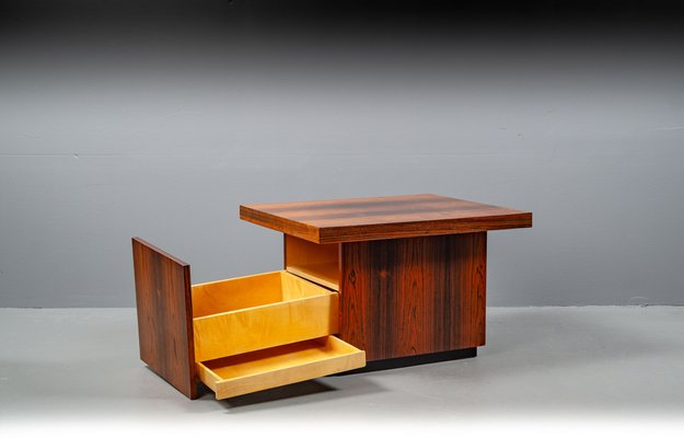 End table with hidden compartment outlet