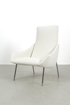 White upholstered online armchair