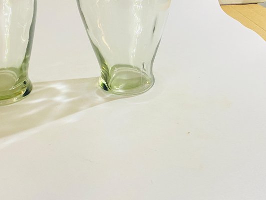 https://cdn20.pamono.com/p/g/1/6/1605197_nyha4xykw2/vintage-decorative-transparent-glass-bottles-in-glass-france-1960s-set-of-2-6.jpg