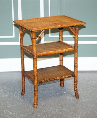 Sold at Auction: Pair of faux bamboo brass side table on ball