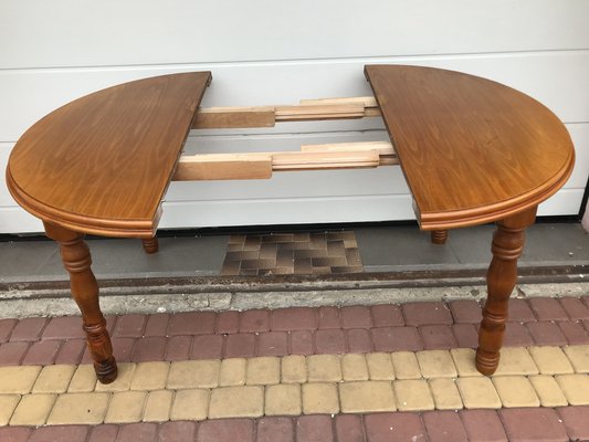 Tavolo rotondo allungabile impiallacciato in quercia con base in