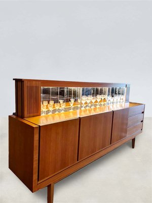 https://cdn20.pamono.com/p/g/1/6/1642869_srhh9eql20/vintage-sideboard-or-cocktail-bar-by-alfons-doerr-1960s-1.jpg