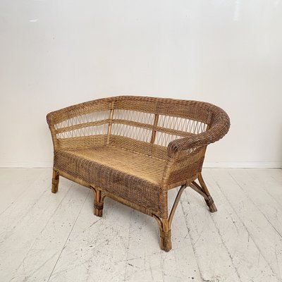 A Mid-Century French Rattan Sofa A Mid-Century French Rattan Sofa
