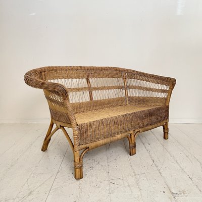 A Mid-Century French Rattan Sofa A Mid-Century French Rattan Sofa