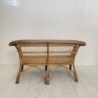 A Mid-Century French Rattan Sofa A Mid-Century French Rattan Sofa