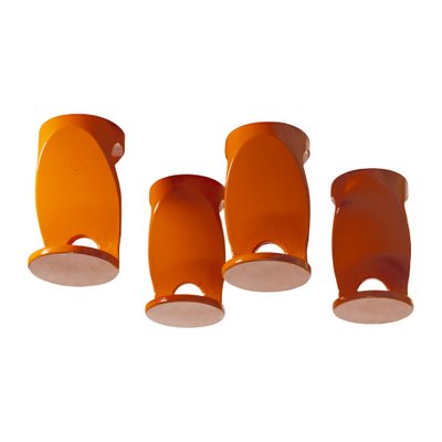 https://cdn20.pamono.com/p/g/1/6/1668680_vfennp1xbt/orange-ceramic-coat-hangers-1970s-set-of-4-4.jpg
