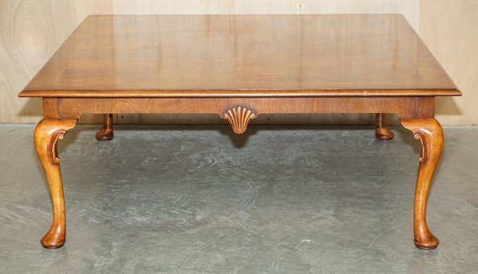 Long Burr Walnut Coffee Table with Cabriolet Legs in the style of