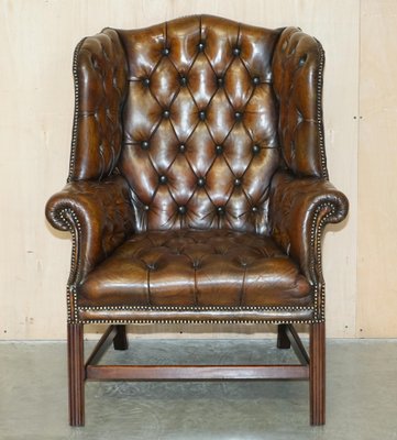 Tufted leather wingback chair discount